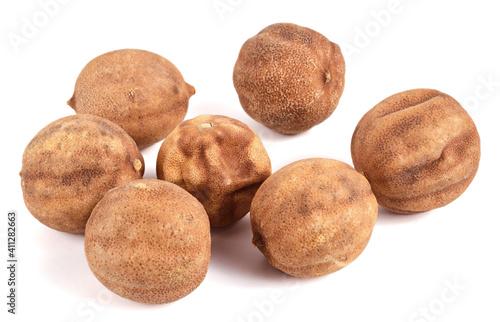 Sun Dried Lime. Dry Lemon (Limu Omani) Isolated on White Background. Also known as Black Lime, Noomi Basra, Limoo Amani and Loomi.