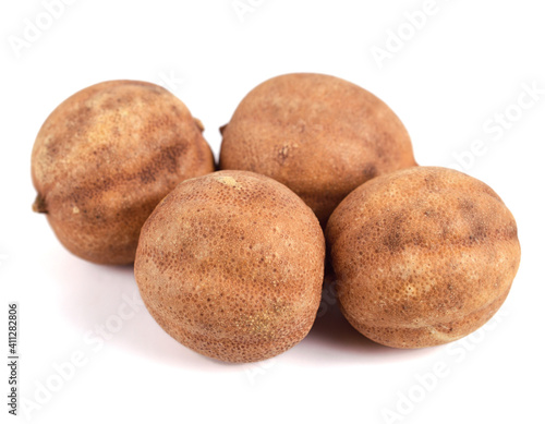 Sun Dried Lime. Dry Lemon (Limu Omani) Isolated on White Background. Also known as Black Lime, Noomi Basra, Limoo Amani and Loomi. photo