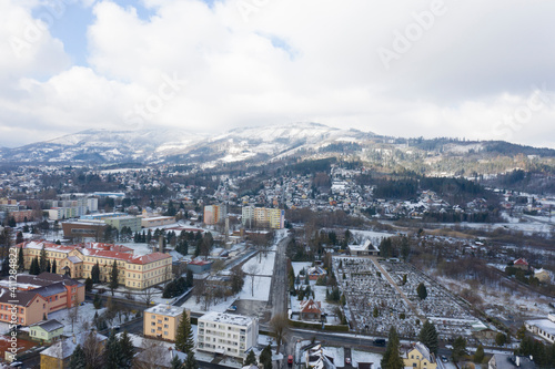 Aerial view of a small town in winter covered in snow