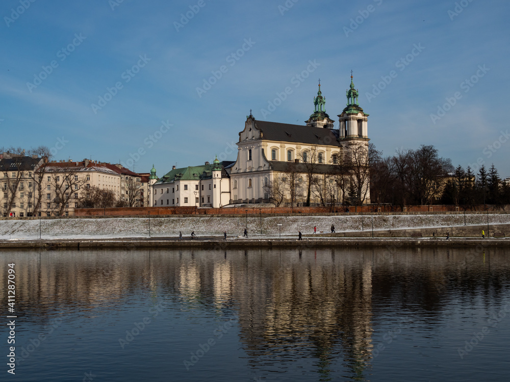 Poland, Cracow - view over Vistula Riverbanks and St. Michael the Archangel and St. Stanisław Church. Winter time.