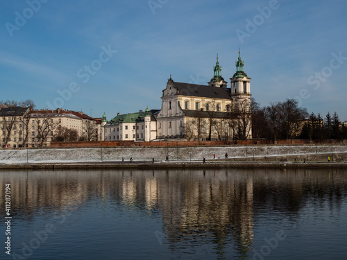 Poland, Cracow - view over Vistula Riverbanks and St. Michael the Archangel and St. Stanisław Church. Winter time.