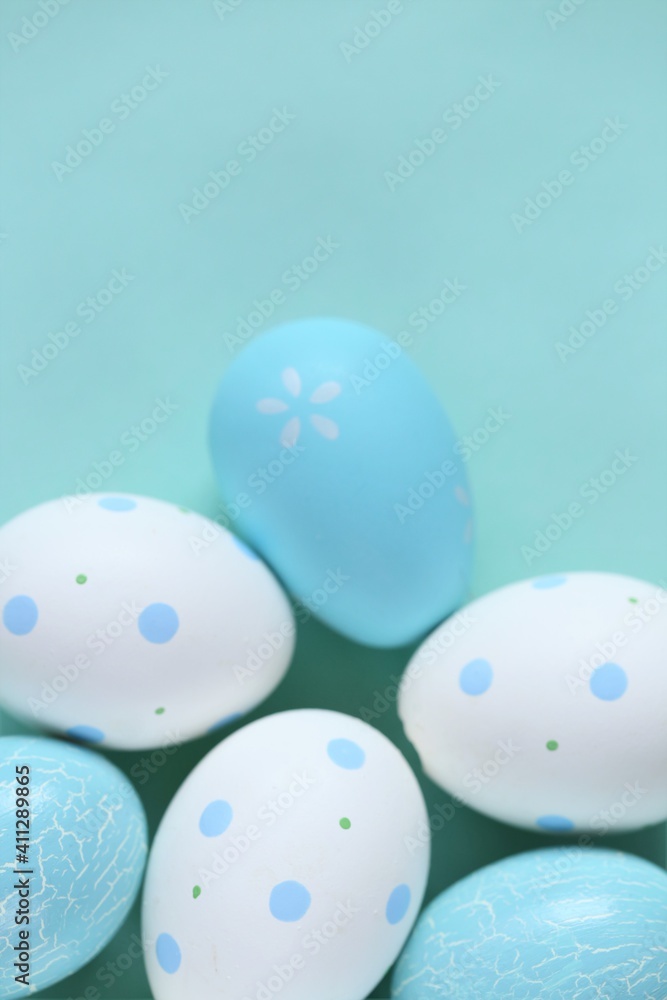 Easter holiday.Easter blue and white  eggs set on light blue background.Spring festive easter background in pastel colors