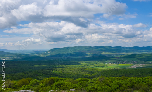 Fototapeta Naklejka Na Ścianę i Meble -  green mountain valley under blue cloudy sky