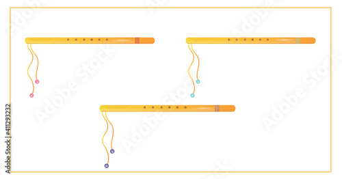 Set of simple golden flutes. Indian musical instrument.