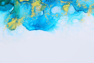 art photography of abstract fluid art painting with alcohol ink, blue and gold colors