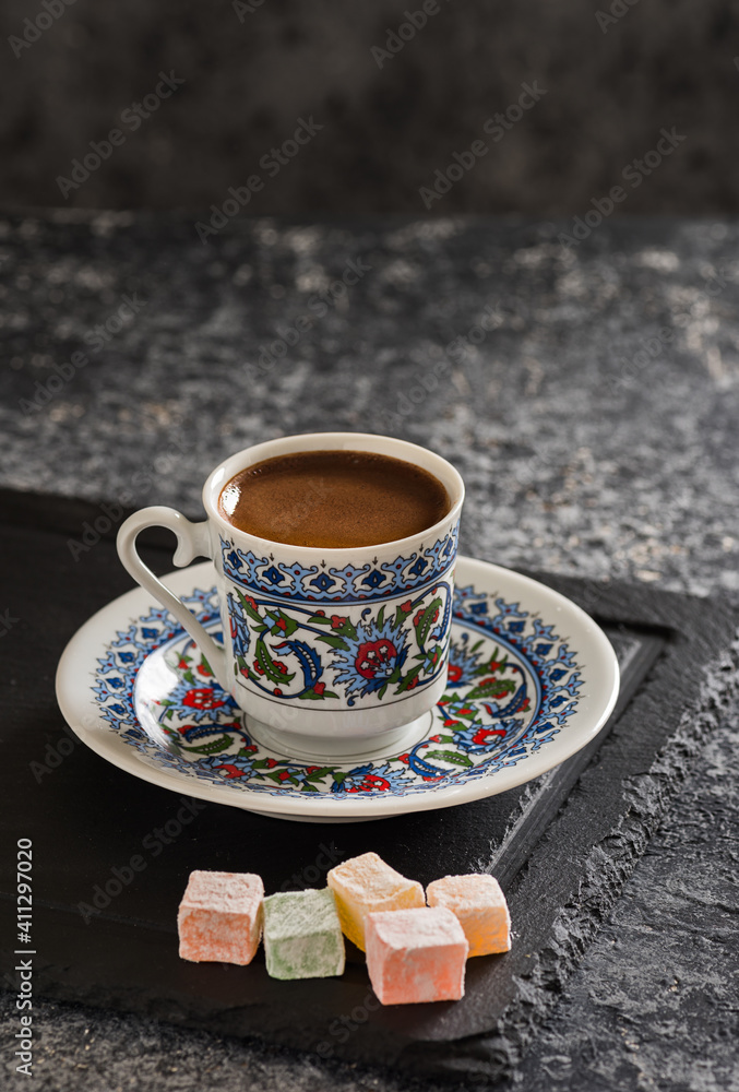 Turkish Coffee with traditional porcelain cup. Coffee presentation with Turkish delight.