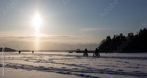 Winter cycling on ice in Kallahti beach, Helsinki, Finland.