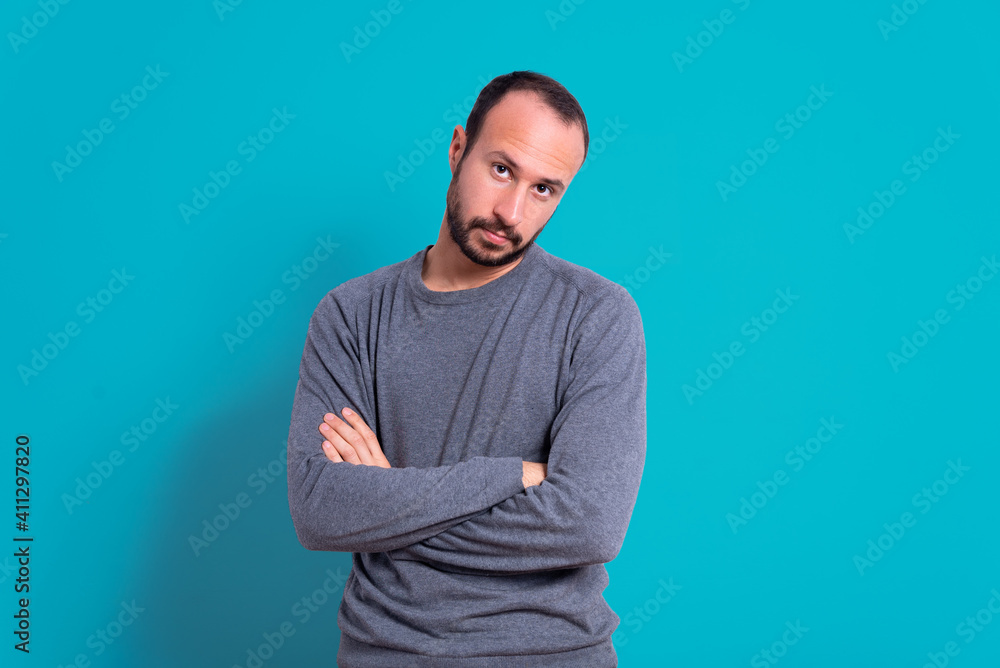 young man in casual clothes with apologetic and guilty expression. concept of regrets and sorrow. crossed arms symbol of fault and asking forgiveness young man in casual clothes with apologetic and guilty expression. concept of regrets and sorrow. crossed arms symbol of fault and asking forgiveness