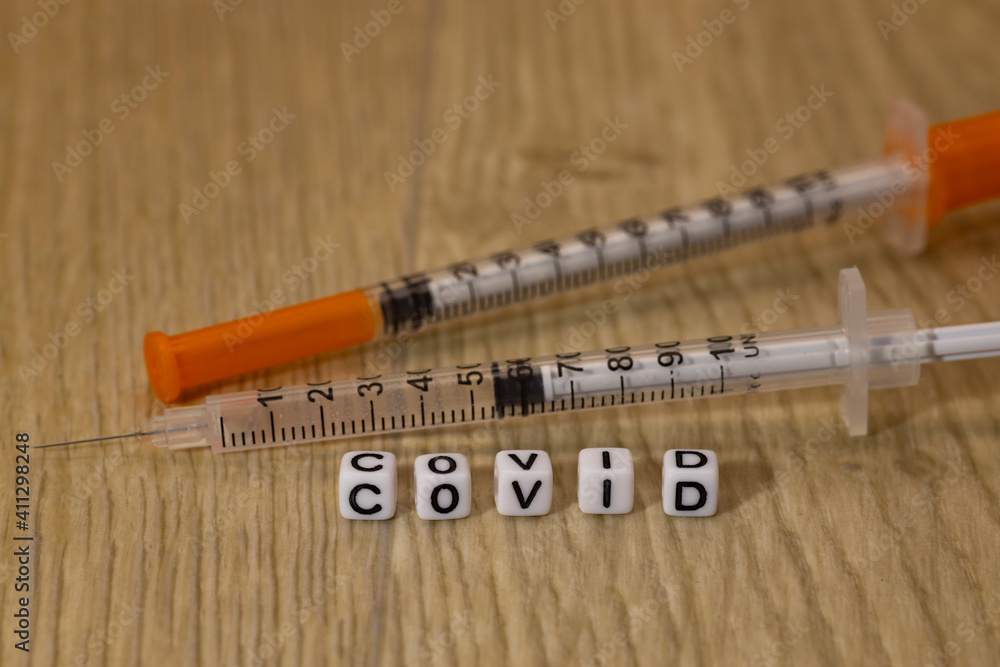 Two syringes and the inscription Two syringes and the inscription