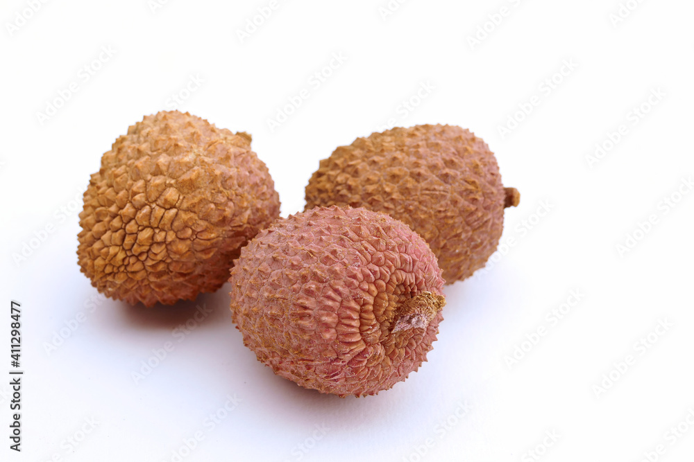 lychee fruits inside a black bowl grouped on white background, isolated, close up photo lychee fruits inside a black bowl grouped on white background, isolated, close up photo
