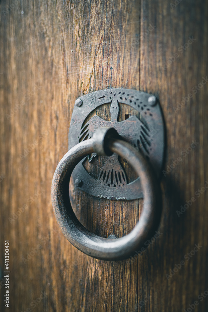 ancient door knob or door knocker on old wood door ancient door knob or door knocker on old wood door