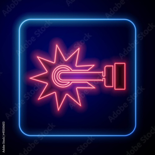 Glowing neon Cowboy horse riding spur for boot icon isolated on blue background. Vector.