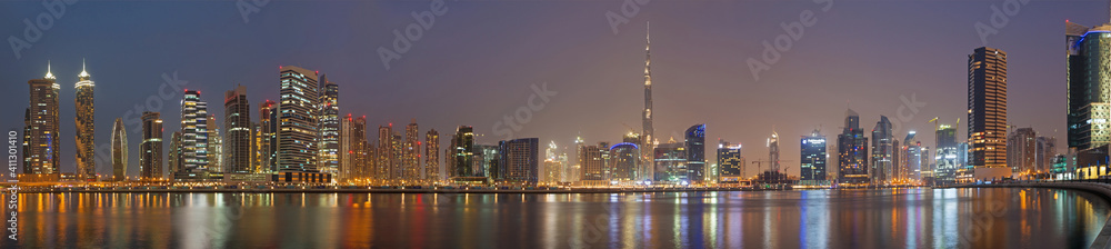 DUBAI, UAE - MARCH 23, 2017: The evening panorama over the new Canal with the Downtown and Burj Khalifa tower.
