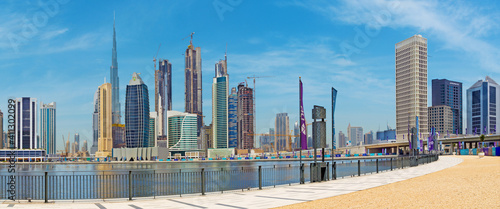 DUBAI, UAE - MARCH 29, 2017: The skyline over the new Canal and Downtown and the promenade.