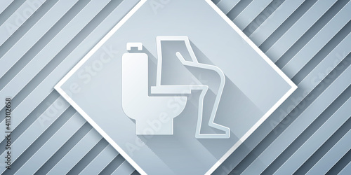 Paper cut Men sitting on the toilet and Constipation are experiencing severe abdominal pain icon isolated on grey background. Paper art style. Vector.