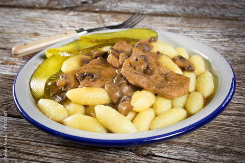 Braised pork loin with mushrooms.