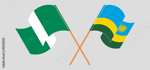 Crossed and waving flags of Nigeria and Rwanda