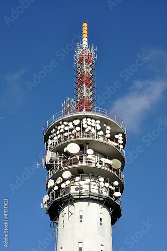 high concrete modern transmitter in day photo