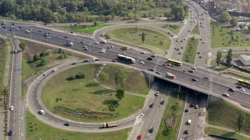 Wallpaper Mural Panoramic aerial view footage of highway multi-level junction road with moving car in Kyiv. Beautiful drone shot from above to the city road traffic in Kiev. Ukraine. Torontodigital.ca