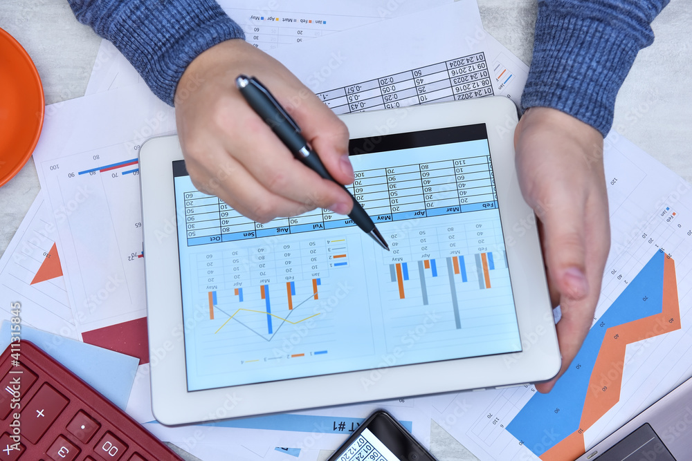 Businessman work with documents on tablet screen. Businessman work with documents on tablet screen.