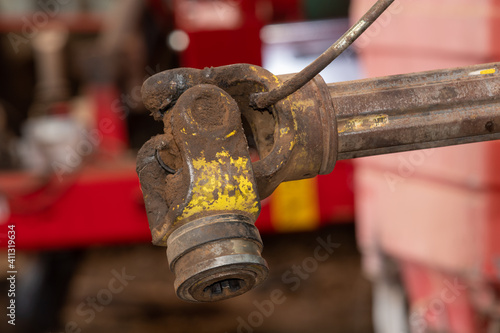 Close up of a pto shaft on a farm machine with a missing pto guard photo