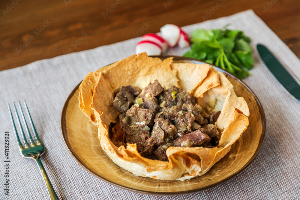 Appetizing meat in baked lavash according Appetizing meat in baked lavash according