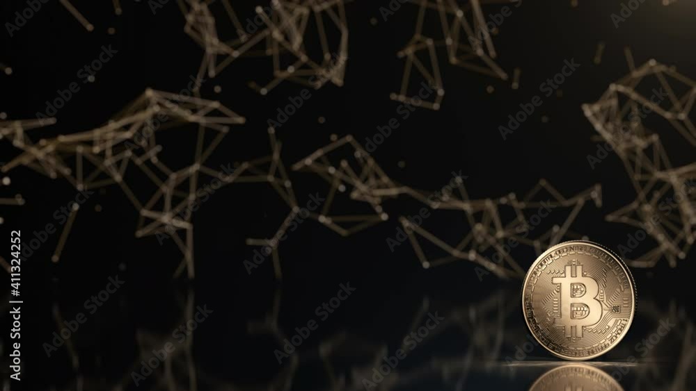 Golden bitcoin coin. Popular digital currency. Cryptocurrency created, distributed, traded, and stored in decentralized ledger system known as blockchain. Abstract plexus background, shiny glow effect Golden bitcoin coin. Popular digital currency. Cryptocurrency created, distributed, traded, and stored in decentralized ledger system known as blockchain. Abstract plexus background, shiny glow effect