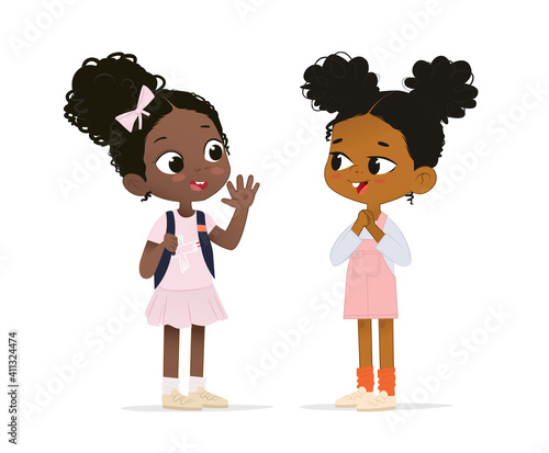 Two African American girls talk to each other. School girl say hello to her new friend. School friends have fun