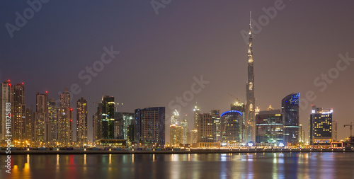 DUBAI, UAE - MARCH 23, 2017: The evening panorama over the new Canal with the Downtown and Burj Khalifa tower.