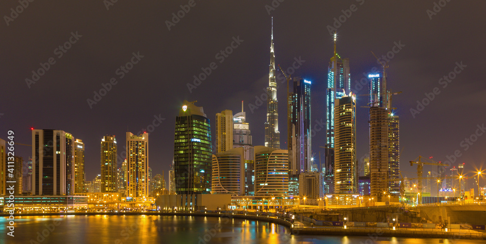 DUBAI, UAE - MARCH 24, 2017: The evening skyline over the Canal and Downtown.