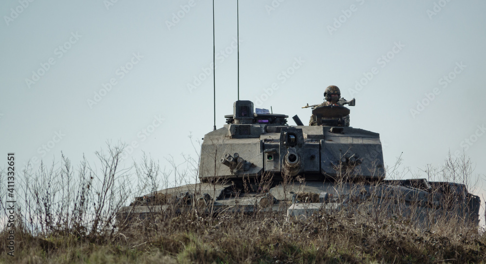 Fototapeta premium Action shot of a British army Challenger 2 FV4034 main battle tank on military exercise, Salisbury Plain UK