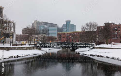 Kalamazoo, Michigan, USA - February 5 2021: Downtown Kalamazoo in snow. view from Arcadia Creek playground. © Daniel