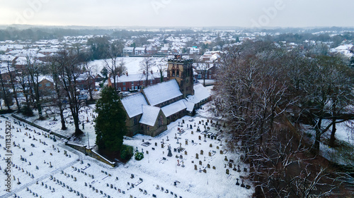 Aerial view of St Johns Church Hartford North with Cheshire in Winter snow. Hartford is a village and civil parish in Cheshire West and Chester. photo