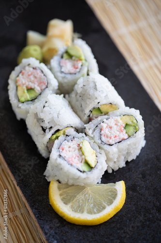 Close-up of Japanese California Roll on a black plate