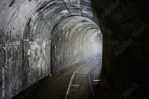 Dark and creepy abandoned mine. Turn of the tunnel © Mulderphoto