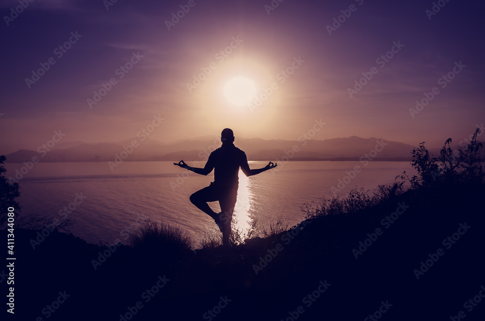 Zen meditation during sunset on the beach