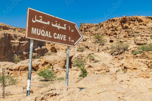 Sign for Muqal Cave at Wadi Bani Khalid.