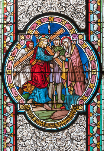 VIENNA, AUSTIRA - OCTOBER 22, 2020: The  Jesus meet his Mother Mary scene on the stained glass in  in church Pfarrkirche Kaisermühlen by  workroom Tiroler Glasmalerei-Anstalt from end of 19. cent..
