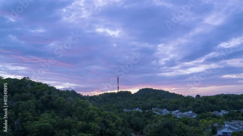 Cinematic Timelapse footage circle view of 5G Communication tower during morning sunrise with clouds, mists and fog