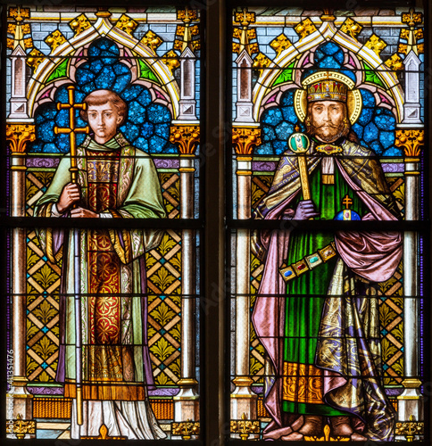 VIENNA, AUSTIRA - OCTOBER 22, 2020: The St. Stephen king of Hungary and St. Laurence on the stained glass of church Laurentiuskirche by workrooms from Czech and Austria (end of 19. cent.).