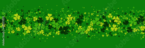 St.Patrick's Day green vector background with clover leaves 