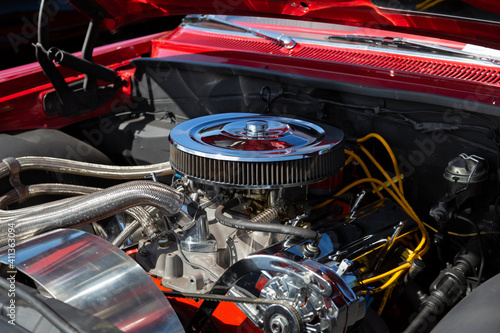 An Under the Hood Side View of Restored Vintage Automobile Engine with Show-Chrome Air Filter