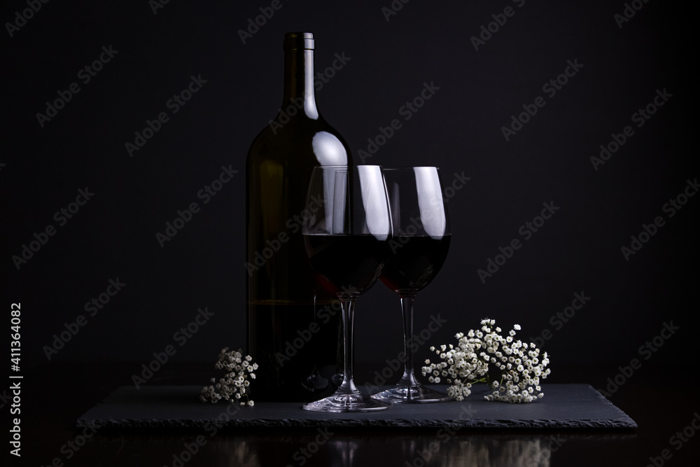 Red wine and two glasses for a romantic date night