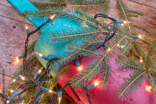 Colorful Maine Red green and white lobster float buoys surrounded by Christmas holiday lights photo