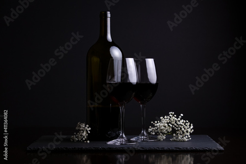 Fototapeta Naklejka Na Ścianę i Meble -  Red wine and two glasses for a romantic date night