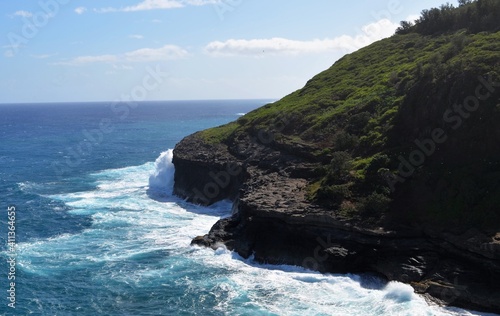 Waves crashing on the rocky shoreline in Hawaii