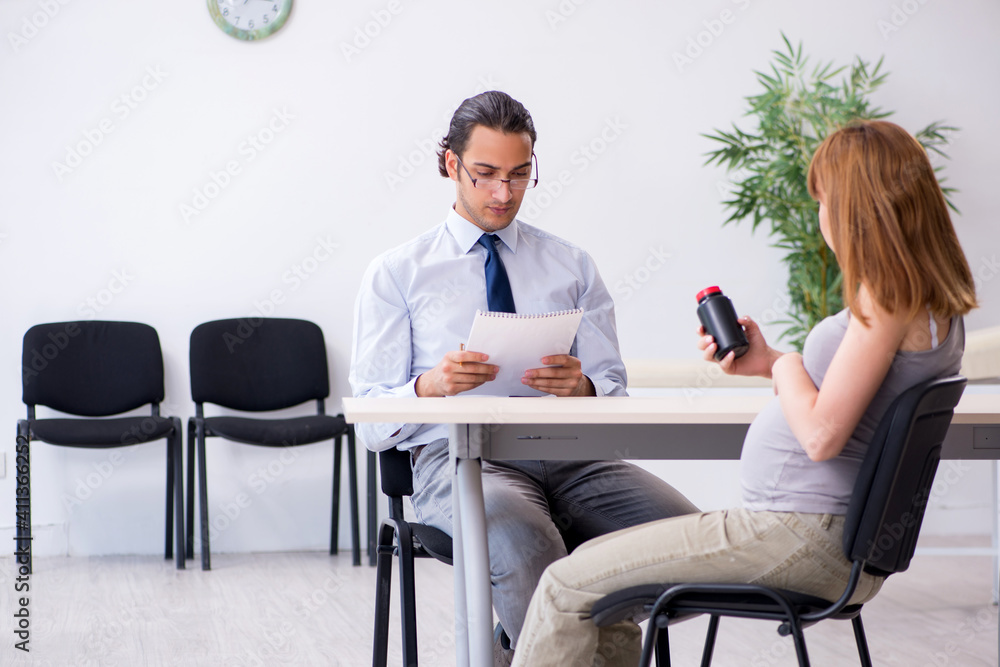 Pregnant woman visiting male psychologist doctor
