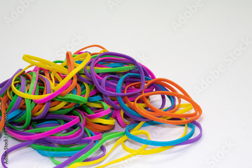 Colorful rubber bands on white