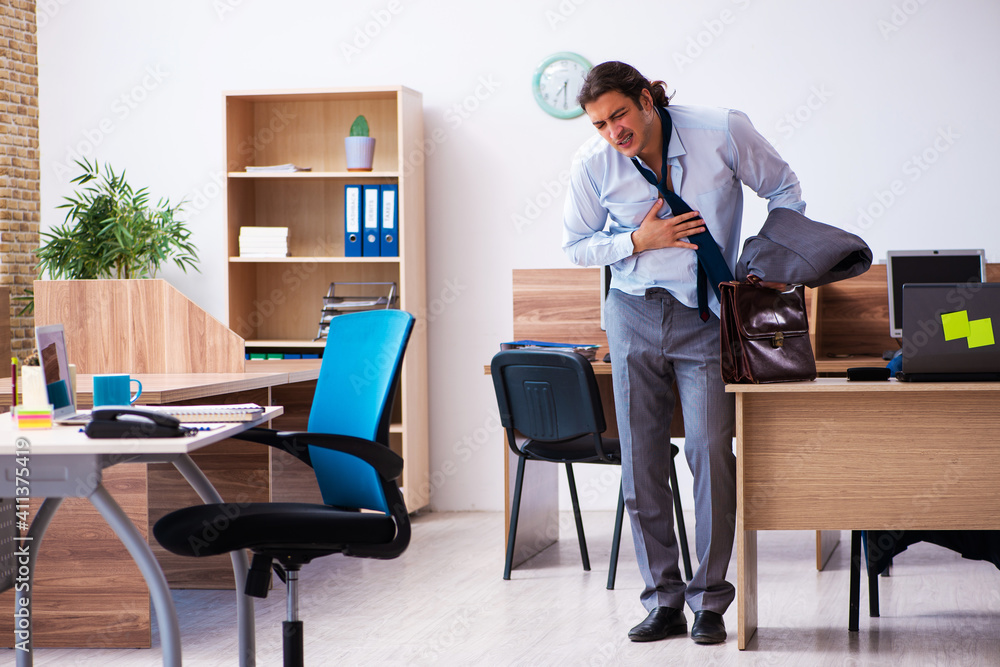 Young male employee being late for his job Young male employee being late for his job
