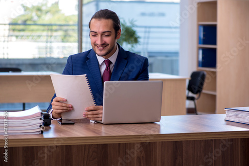 Young businessman employee working in the office © Elnur